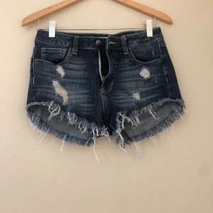 Cut-off frayed blue jean shorts